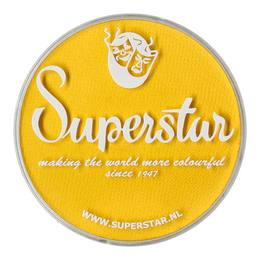 A round container with a yellow lid displays Superstar in white text, alongside a theatrical mask logo. It reads making the world more colourful since 1947 and WWW.SUPERSTAR.NL. Ideal for Aqua Face- and Bodypaint, this water-based makeup by Infinity Faces is proudly cruelty-free.