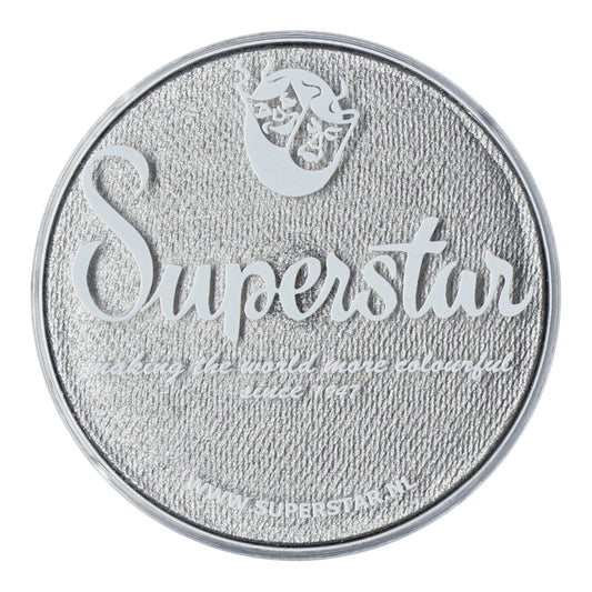 A round silver tin lid from Infinity Faces, featuring Superstar embossed with a mask logo. It states, making the world more colorful since 1947, and includes the Superstar Aqua Face and Bodypaint website link for their cruelty-free, water-based makeup.