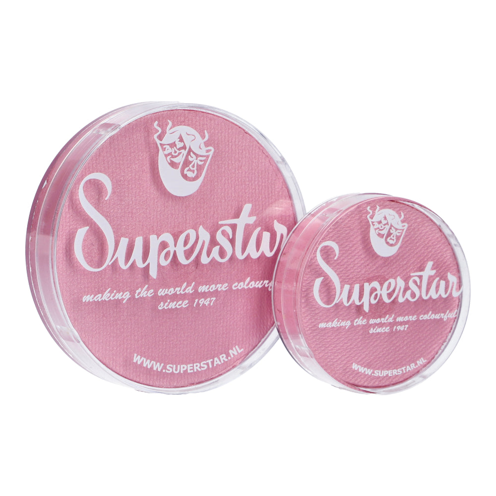 Two pink face paint containers, one large and one small, feature white Superstar text and a decorative mask logo. These cruelty-free Infinity Faces Superstar Aqua Face & Body Paints highlight making the world more colourful since 1947 and www.superstar.nl.