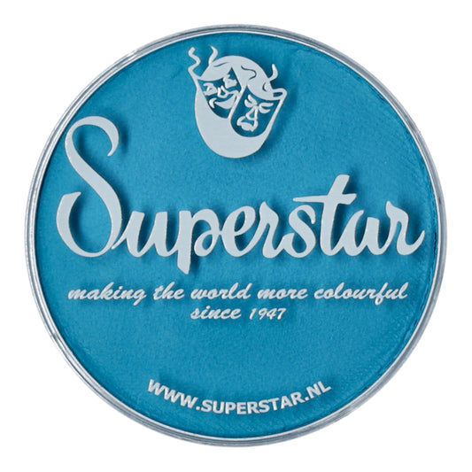 A round blue tin lid reads Superstar in white, with making the world more colourful since 1947 below. The bottom shows www.superstar.nl and features a stylized face logo. Infinity Faces cruelty-free Face Paint & Body Paint Aqua Superstar - Magic Blue (45gr) offers vibrant water-based makeup options.