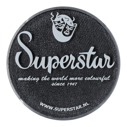 A circular black patch with white cursive Superstar below a mask logo reads, Making the world colorful since 1947 with Aqua Face & Body Paint, featuring Infinity Faces cruelty-free water-based makeup. Visit www.superstar.nl for their Graphite (shimmer) product.