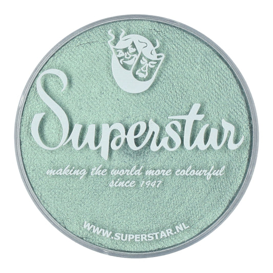 Round container of mint green makeup featuring the Infinity Faces logo with making the world more colourful since 1947 in white font. A stylized mask sits above, showcasing Face Paint & Body Paint Aqua Superstar - Seashell Shimmers vibrant colors. Visit www.superstar.nl for this water-based beauty.