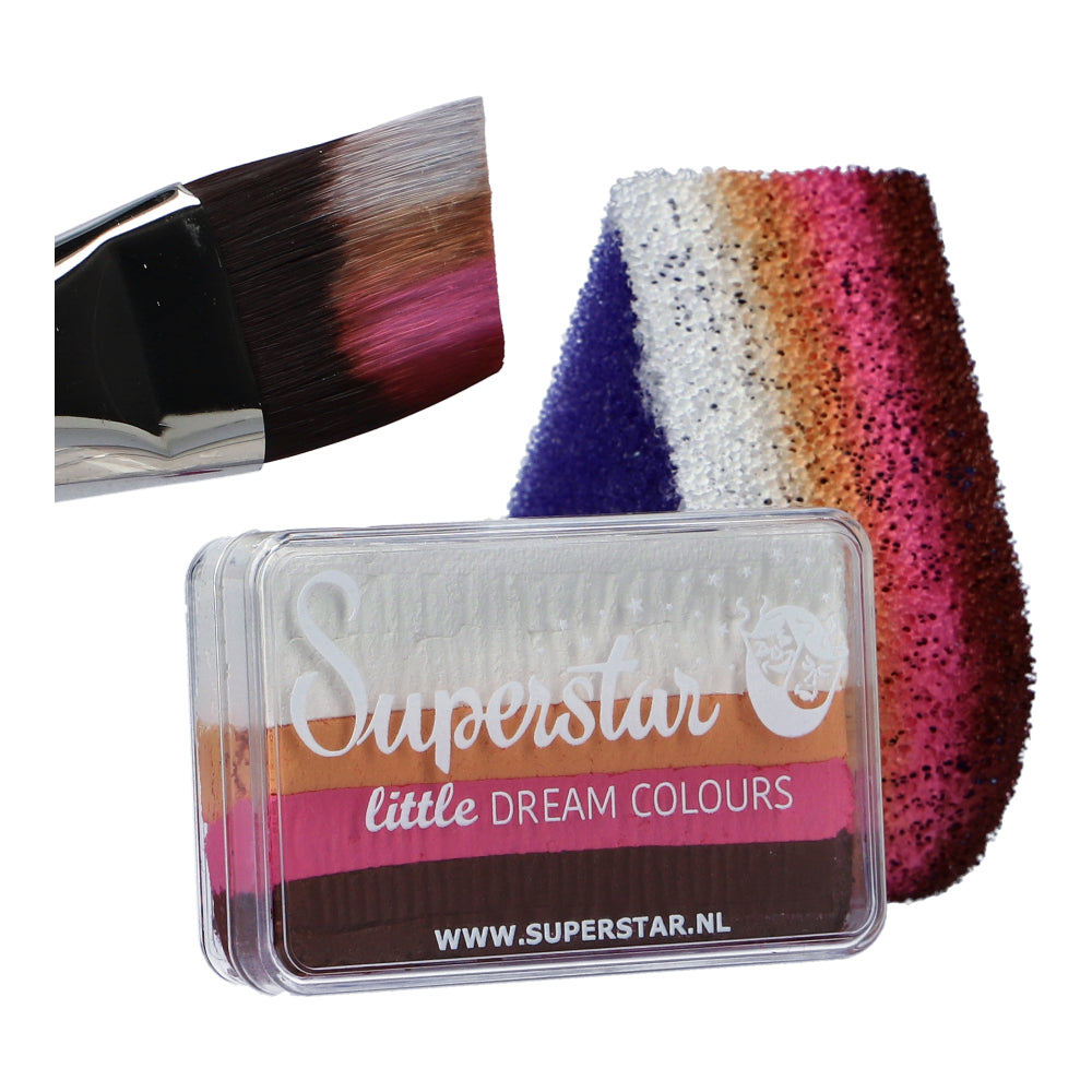 An up-close view of the Face Paint & Body Paint Aqua Superstar - Little Rose by Infinity Faces showcases a vibrant gradient of black, brown, pink, white, and purple shades. A brush is dipped in pink and white beside a rainbow swatch on fabric. This cruelty-free, water-based makeup suits any occasion.