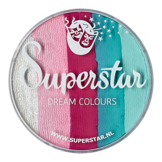 A circular paint palette, Split Cake Dream Colour Superstar - Ice Cream (45gr) by Infinityfaces, features vertical stripes of white, pink, red, blue, and teal. A stylized face and stars are above the text. This Aqua Face- and Bodypaint complies with the European Cosmetics Directive for safety.