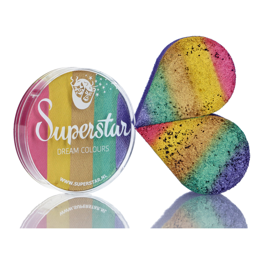 A clear-lidded container labeled Split Cake Dream Colour Superstar - Unicorn by Infinityfaces holds high-quality, heart-shaped rainbow powder. Ideal for face and body painting enthusiasts, the pink, yellow, green, blue, and purple layers promise vibrant creativity.