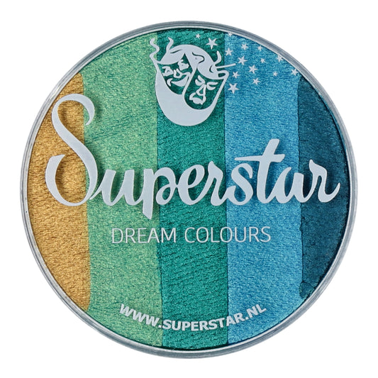 The round container of Split Cake Dream Colour Superstar - Emerald (45gr) by Infinityfaces boasts vibrant gold, green, teal, and blue bands. The lid showcases Superstar Dream Colours with a mermaid logo and URL underneath. It complies with the European Cosmetics Directive for safe use.