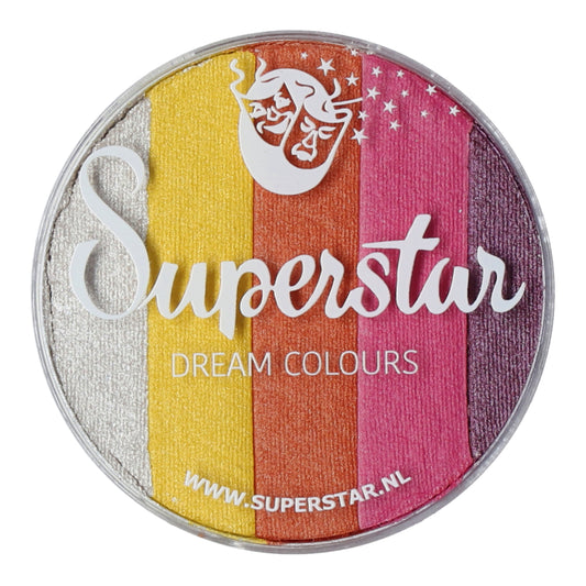 The Split Cake Dream Colour Superstar - Sunshine (45gr) by Infinityfaces features vertical stripes of metallic silver, yellow, orange, pink, and purple face paint. The logo includes a stylized mask with stars. Complies with the European Cosmetics Directive and displays the website URL at the bottom.