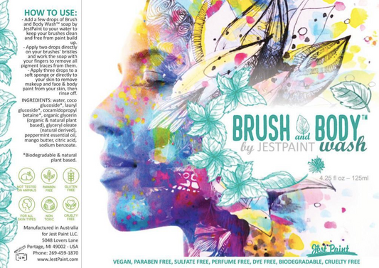 The label for Infinity Faces Brush & Body Wash Soap by Jest Paint fits a 50 ml Superstar Spray Bottle and showcases an artistic face profile with floral and leaf patterns. It includes instructions, ingredients, specs, and symbols indicating its vegan, eco-friendly, and reusable.