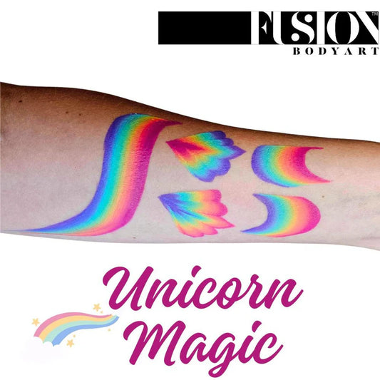A forearm shows four curved and butterfly wing-like swatches of Infinityfaces Face Paint & Body Paint Aqua Fusion - Unicorn Magic One Stroke (30g), featuring a shooting star graphic.