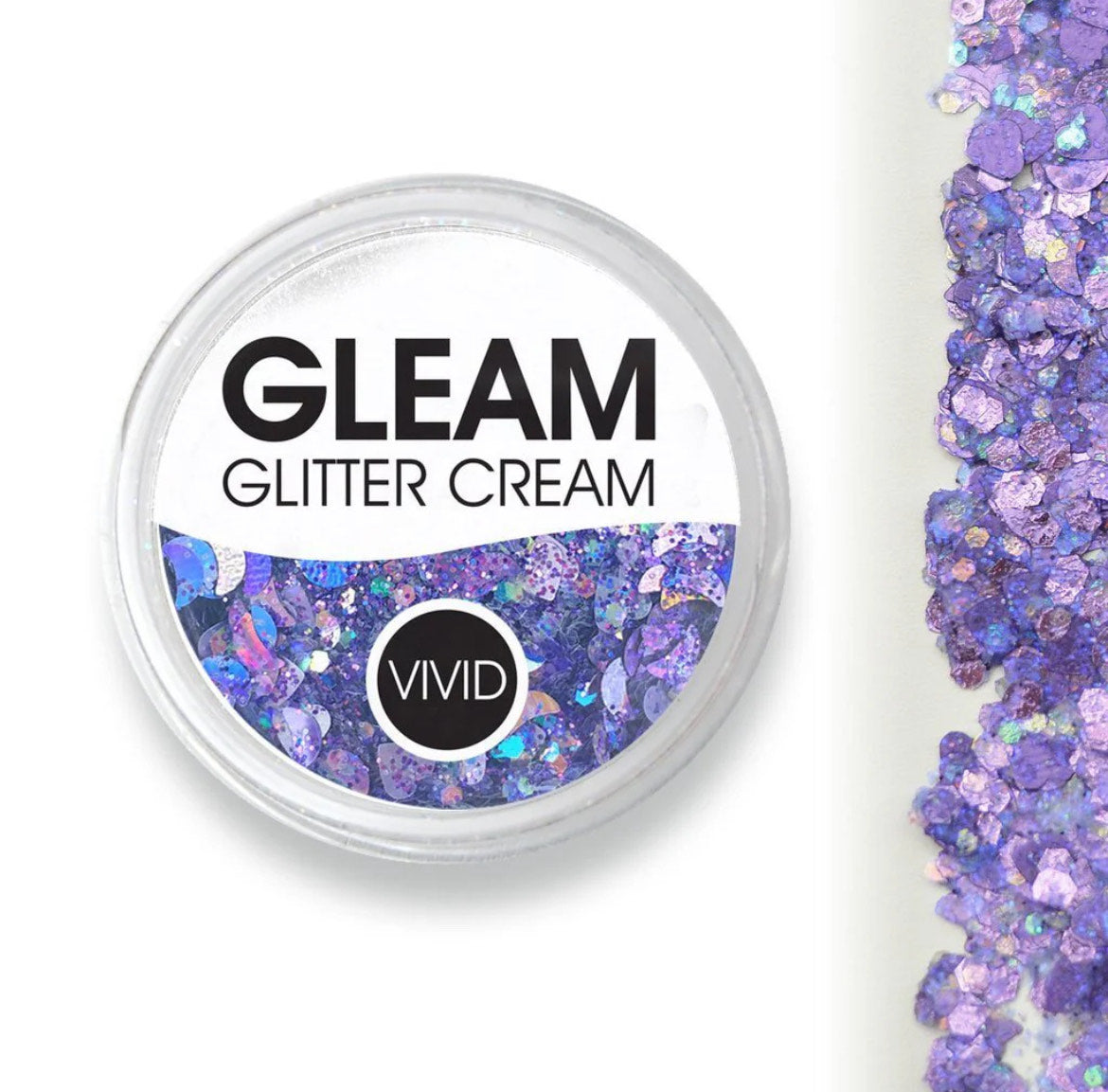 An open round container labeled Glitter Cream Gleam - Purpose (10g) by Infinity Faces reveals chunky, iridescent purple and blue glitter, with a streak of scattered glitter next to it on a white background.