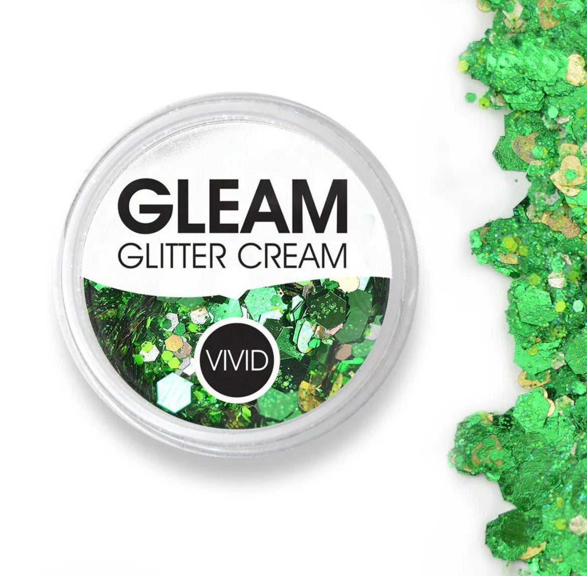 An open round container of Infinity Faces Glitter Cream Gleam - Evergreen (10g) displays vibrant green chunky glitter, with loose green and gold glitter pieces scattered nearby on a white background.