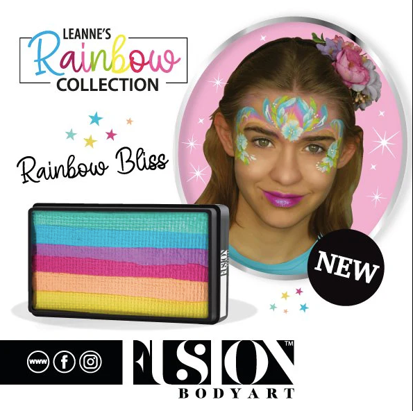 A smiling young girl with a colorful butterfly face paint and flower headband models Infinity Faces Face- & Body Paint Aqua Fusion - Leannes Rainbow Bliss - One Stroke (30g), ideal for blended effects with a flat brush. NEW!.