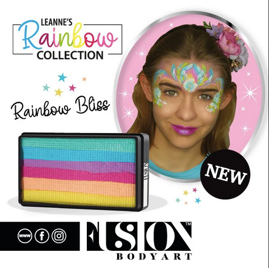 A smiling young girl with a colorful butterfly face paint and flower headband models Infinity Faces Face- & Body Paint Aqua Fusion - Leannes Rainbow Bliss - One Stroke (30g), ideal for blended effects with a flat brush. NEW!.