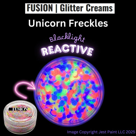 A round 10g container of Infinity Faces Glitter Cream Fusion - Unicorn Freckles UV is shown with bright neon glitter inside, labeled Blacklight Reactive. The Fusion logo appears at the top.