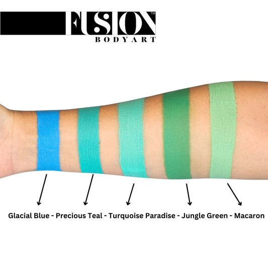 Five swatches of Fusion Face Paint & Body Paint aqua Fusion - Prime Turquoise Paradise on an arm, labeled from left to right as Glacial Blue, Precious Teal, Turquoise Paradise, Jungle Green, and Macaron.