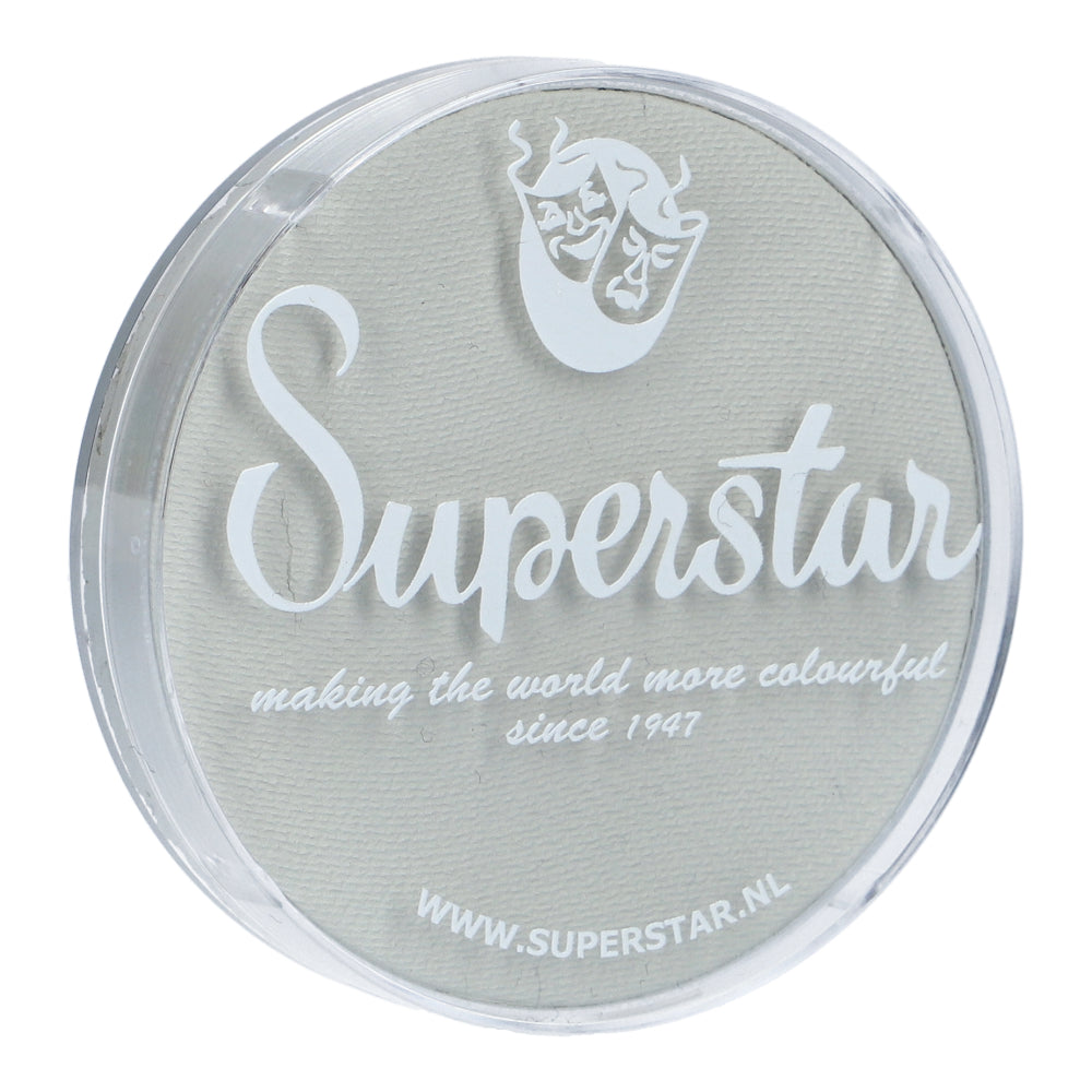 A round plastic container featuring Superstar in white on the lid highlights its making the world more colourful since 1947 mantra beside a theatrical masks logo. Infinity Faces Face Paint & Body Paint Aqua Superstar adheres to European Cosmetics Legislation. Visit WWW.SUPERSTAR.NL for details.