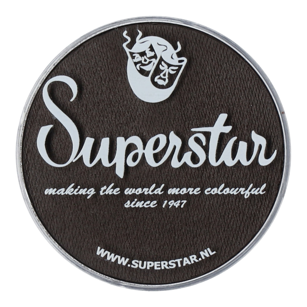 A black round logo displays Superstar in large cursive font with the tagline, making the world more colourful since 1947. At the bottom is www.superstar.nl, offering child-friendly Face Paint & Body Paint Aqua Superstar - Dark brown (45gr) by Infinity Faces.