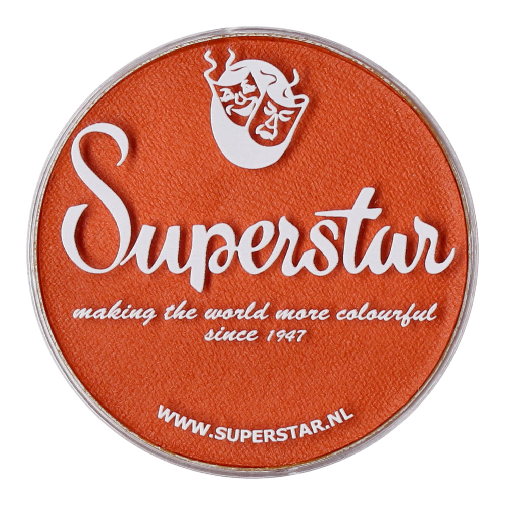 The orange circular makeup container features the Infinity Faces Superstar logo and a white silhouette of flowing hair. This water-based, cruelty-free Face Paint & Body Paint Aqua Superstar - Dark Orange (16gr) has added color to the world since 1947. Visit www.superstar.nl for more details.