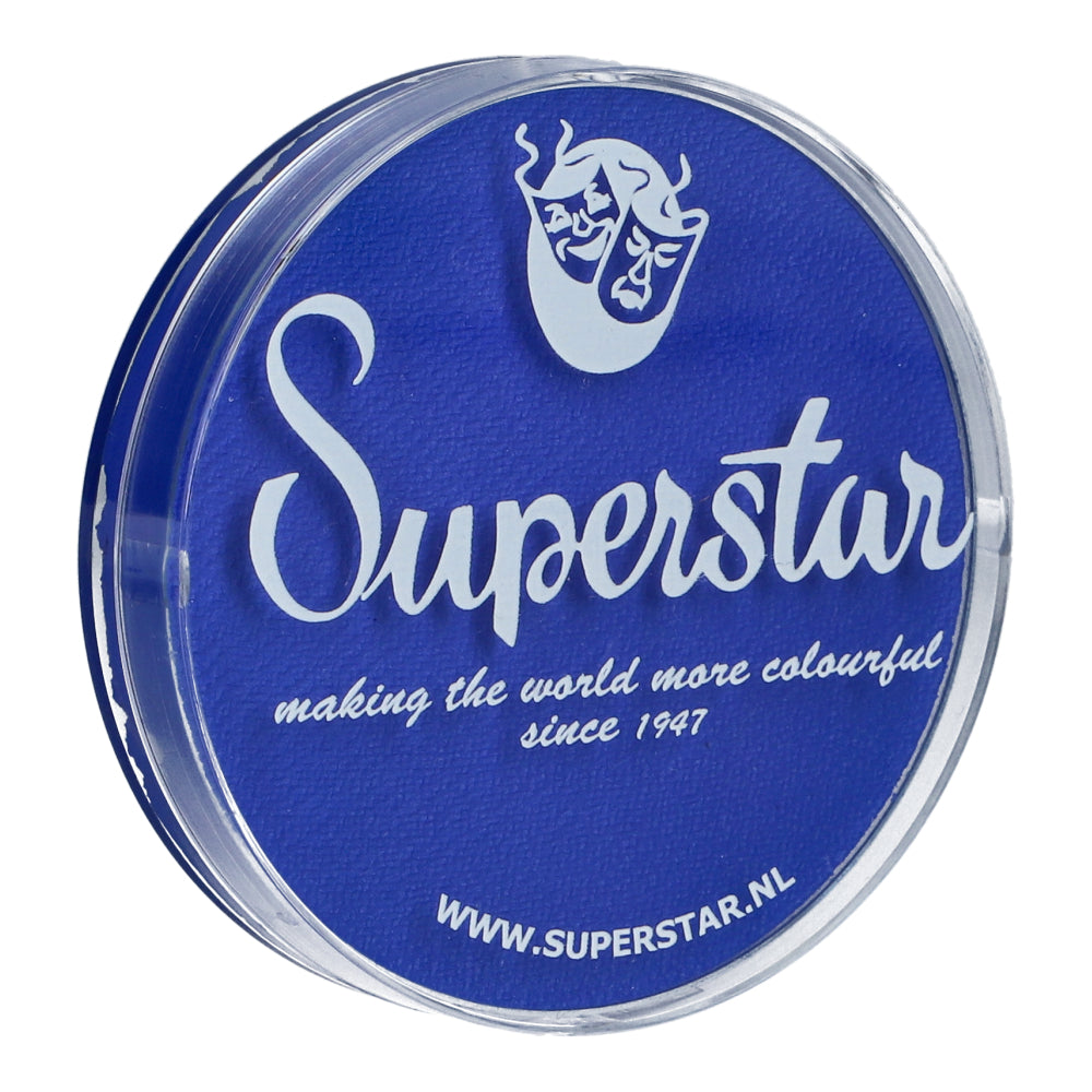 Round face and body paint container by Infinity Faces, featuring a blue lid with white text and a theater mask logo. Reads: Superstar, making the world more colourful since 1947. This cruelty-free, water-based makeup is available at www.superstar.nl.