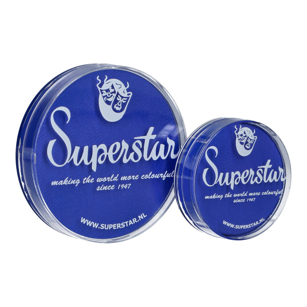 Two round containers with blue lids feature the Superstar logo and a stylized face, labeled making the world more colourful, since 1947 and display www.superstar.nl. They contain cruelty-free Infinity Faces aqua face and body paint. The larger container holds 16g of Bright Blue paint.