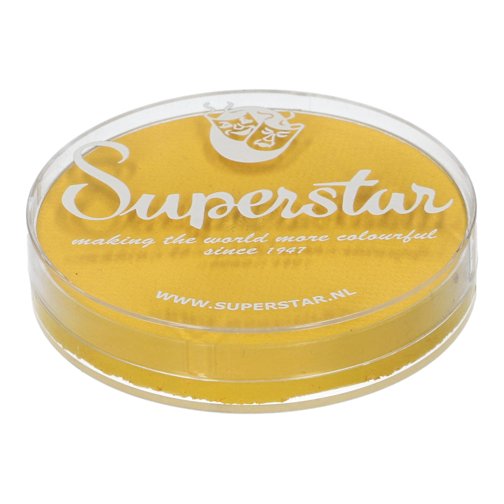 A transparent circular container holds Infinity Faces Face Paint & Body Paint Aqua in bright yellow, featuring Superstar in white cursive with the tagline making the world more colourful since 1947. This cruelty-free, water-based makeup is available at www.superstar.nl.