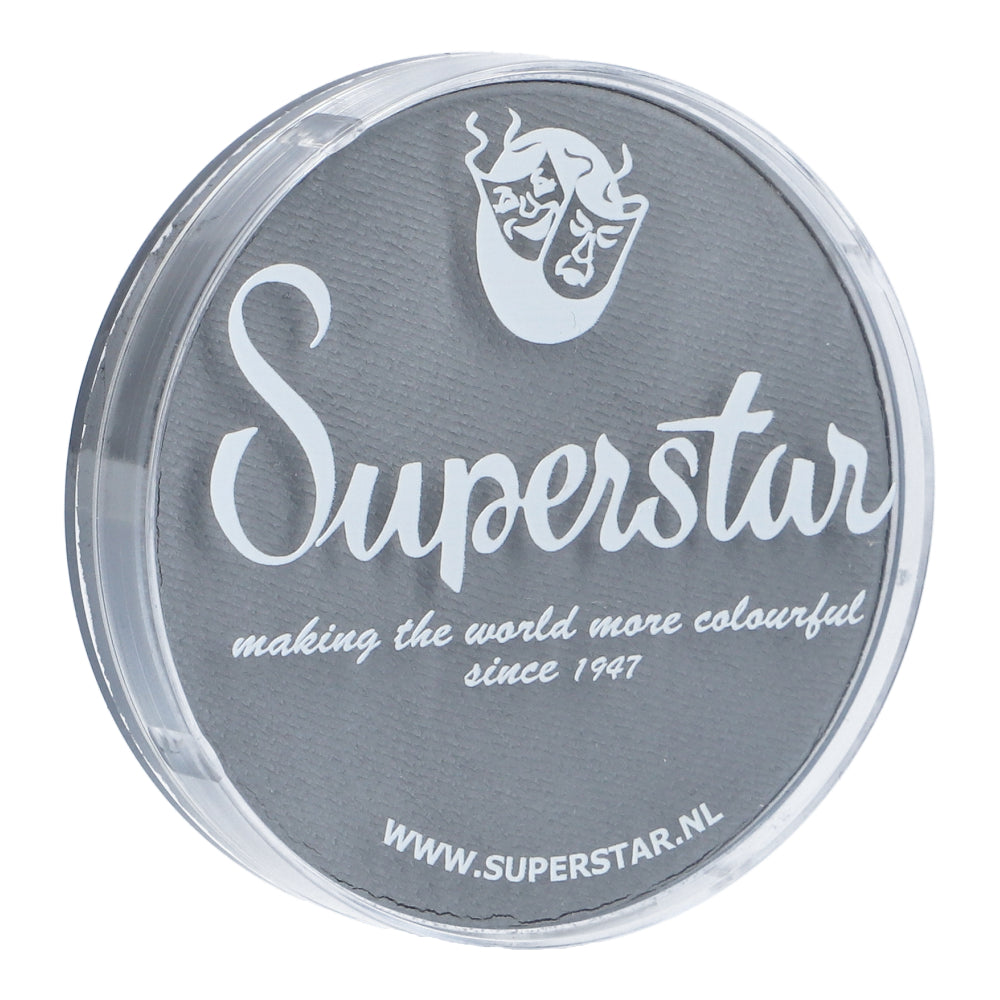 A round, clear container with a gray lid and white text reads, Face Paint & Body Paint Aqua Superstar - Light grey (16gr) by Infinity Faces. It features child-friendly Aqua Face- and Bodypaint with a logo of two theatrical masks. Visit our website at www.superstar.nl for more details.