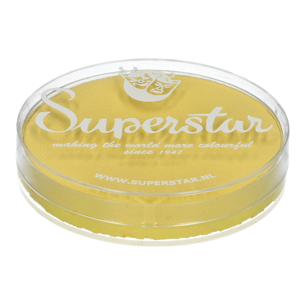 Round container of Face Paint & Body Paint Aqua Superstar in soft yellow (16g) by Infinity Faces with a transparent lid, featuring a decorative mask logo. Proudly cruelty-free and compliant with European Cosmetics Legislation, Infinity Faces has been making the world more colorful since 1947.
