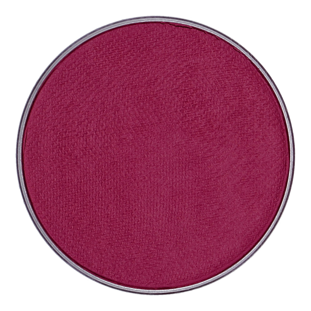 A close-up of a round pan shows deep pink Face Paint & Body Paint Aqua Superstar - Majestic Magenta (45gr) by Infinity Faces. It has a smooth, slightly textured surface encased in a thin metallic rim, designed for child-friendly application, ensuring safety and ease of use.