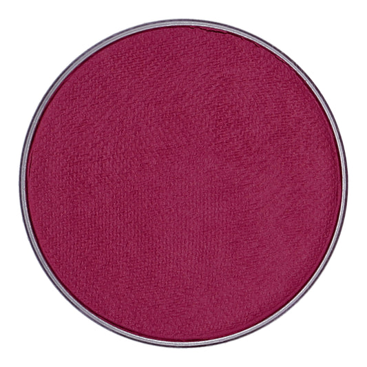 A close-up of a round pan shows deep pink Face Paint & Body Paint Aqua Superstar - Majestic Magenta (45gr) by Infinity Faces. It has a smooth, slightly textured surface encased in a thin metallic rim, designed for child-friendly application, ensuring safety and ease of use.