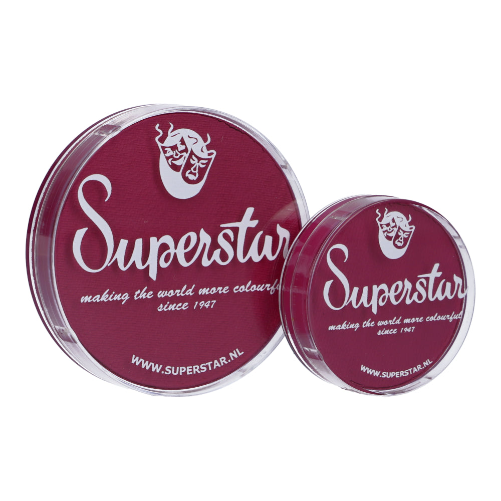 Two circular containers boast burgundy lids with a face mask logo and Superstar text. Infinity Faces Majestic Magenta Aqua Face & Body Paint (45g) products, child-friendly since 1947, brighten the world. Visit www.superstar.nl for more info.