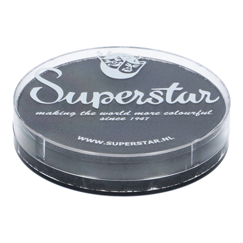 The round, clear plastic container with a black lid displays Superstar in white with a mask design. This cruelty-free, water-based Graphite (shimmer) paint by Infinity Faces has been adding color since 1947 and includes details for Aqua Face and Bodypaint fans.