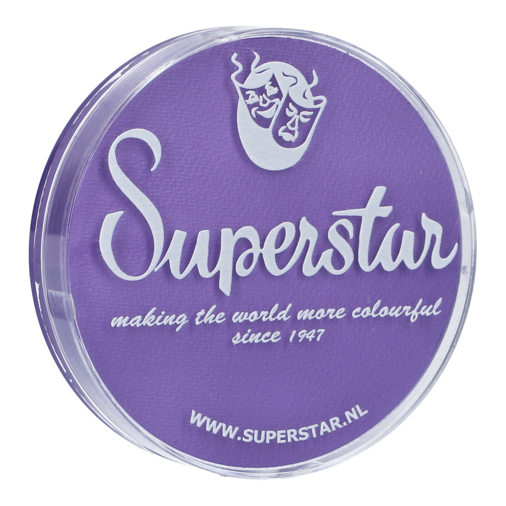 A round container with a purple lid says Face Paint & Body Paint Aqua Superstar - La-laland (16gr) from Infinity Faces in bold white. It boasts making the world more colourful since 1947 beneath a white comedy-tragedy mask logo, highlighting its cruelty-free water-based formula. A URL is at the bottom.