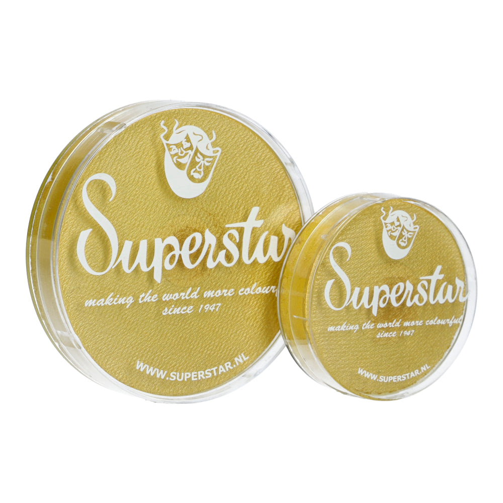 Two round containers of Infinity Faces Superstar face paint are showcased, one larger than the other. These cruelty-free, water-based products offer a golden shimmer. Text and logo: making the world more colourful since 1947 and www.superstar.nl.