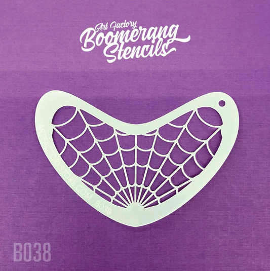 A white Spider Web Boomerang Stencil Body Art by Infinity Faces, shaped like a boomerang with a spider web design, is shown on a purple background. The stencil is labeled B038.