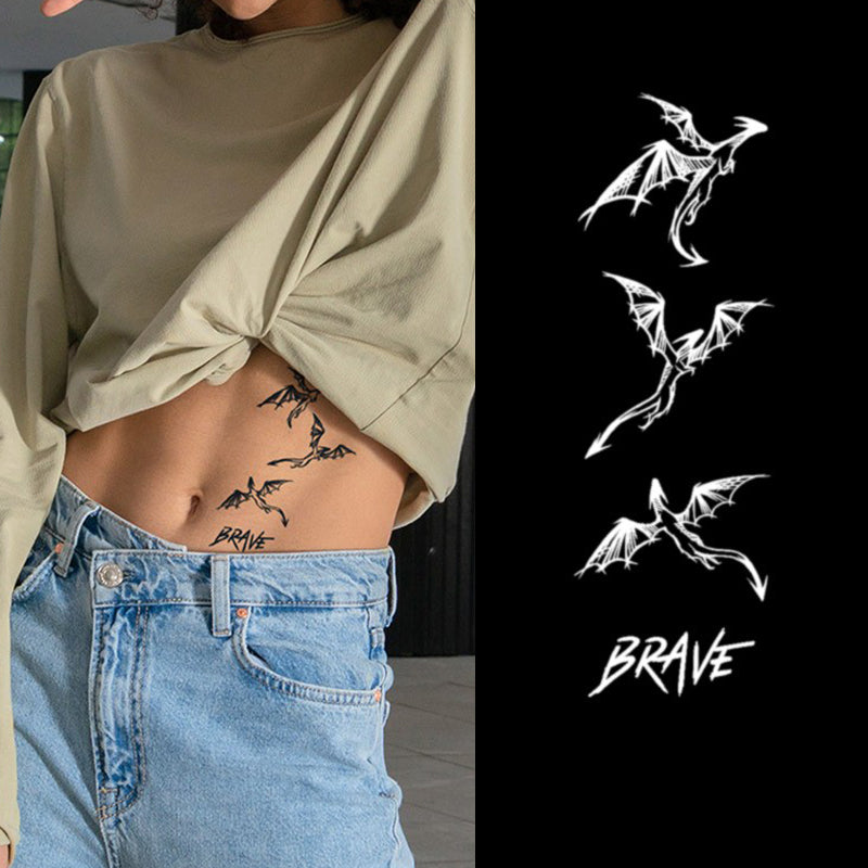 A person in a beige top and blue jeans shows off a side tattoo of flying bats with BRAVE as natural body art. Nearby, Infinityfaces Temporary Herbal Tattoo - Brave Dragon is displayed with three bat silhouettes and BRAVE in white on black.