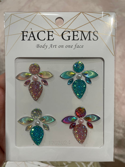 The Face- & Body Gems - Queen by Infinityfaces feature colorful gem designs in pairs, blending multi-colored and iridescent stones with pearl accents. These adhesive gems form floral patterns with leaves and petals.