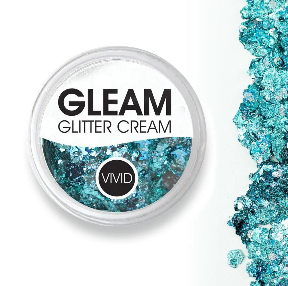 A round container labeled Infinity Faces Glitter Cream Gleam - Angelic Ice (10g) filled with turquoise blue glitter cream, next to a spill of the same glitter on a white surface.