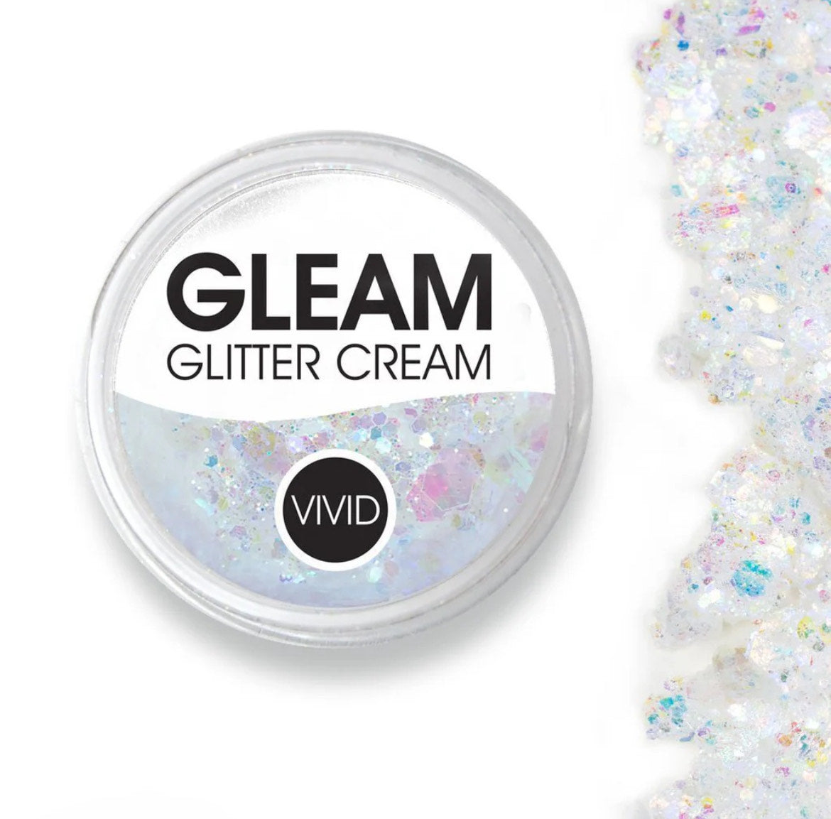 A round container labeled Infinity Faces Glitter Cream Gleam - Purity Chunky (10g), filled with iridescent glitter cream, sits beside a scattered pile of the same glitter on a white background.