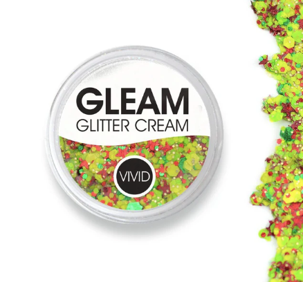 A round container of Infinity Faces Glitter Cream Gleam - Carnaval (10g), filled with chunky neon yellow, green, and red glitter. Some glitter is scattered outside the container on a white background.