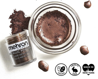 A jar of Infinityfaces Metallic Powder Make Up Mehron - Bronze (21g), renowned for its metallic shine, sits beside a small bowl of mixed paste. The bronze powder comes alive with Mehron Mixing Liquid. Icons below confirm its vegan, cruelty-free, and crafted in New York.