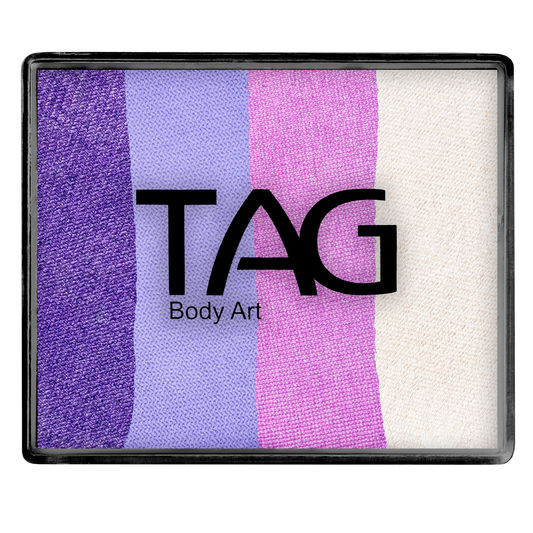 A 50g rectangular Face Paint & Body Paint Aqua - Snowflake Split Cake by Infinityfaces, featuring four vertical stripes of dark purple, lavender, pink, and white. The palette is labeled with bold TAG Body Art lettering.