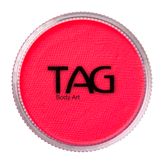 A round container of Infinity Faces Face Paint & Body Paint Aqua Tag - UV Neon Pink (32g) with the brand name on the lid, which has a ridged, clear edge.