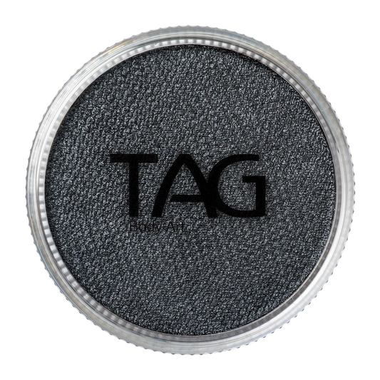 A round container of Infinity Faces Face Paint & Body Paint Aqua Tag in Pearl Black (32g), shown from above with the TAG label visible on the textured makeup surface.