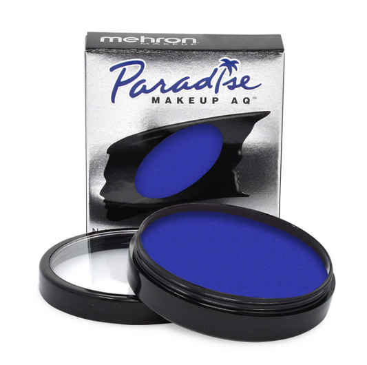 A silver Infinityfaces box labeled Face Paint & Body Paint Aqua Paradise Make Up AQ Mehron - Dark Blue (40gr) stands behind an open container of dark blue face paint, with the lid set aside.