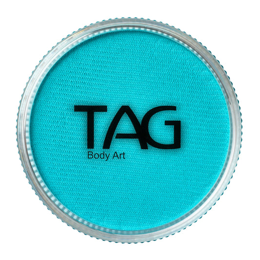 Round container of TAG Face & Body Paint - Aqua Blue (32g) with bright aqua blue face and body paint.