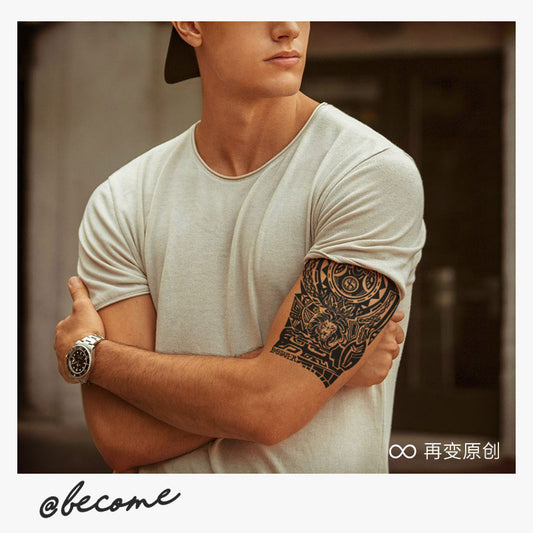 A person wearing a light beige t-shirt and a watch stands with arms crossed, displaying the detailed Infinityfaces Temporary Herbal Tattoo - Money and Power in black on their upper arm against a blurred background. The bottom text reads @become with symbols and more text to the right.