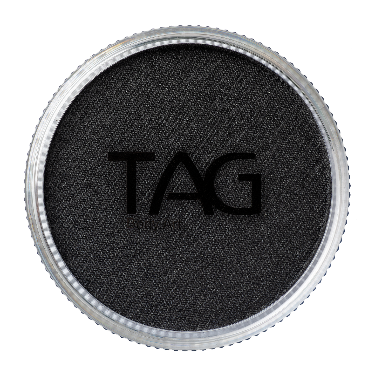 Close-up of a round black textured item, similar to a lid, says TAG at its center. This Face Paint & Body Paint Aqua Tag - Black (90g) by Infinityfaces features a metallic-finished outer edge.