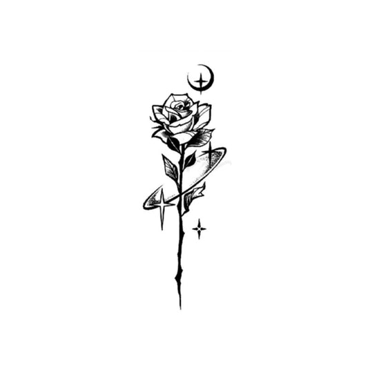 The Temporary Herbal Tattoo - Rose in a Starry Night by Infinityfaces features a black and white design with a long-stemmed rose, Saturn-like rings, a crescent moon above, and a small star below—ideal for plant-based tattoo inspiration seekers.