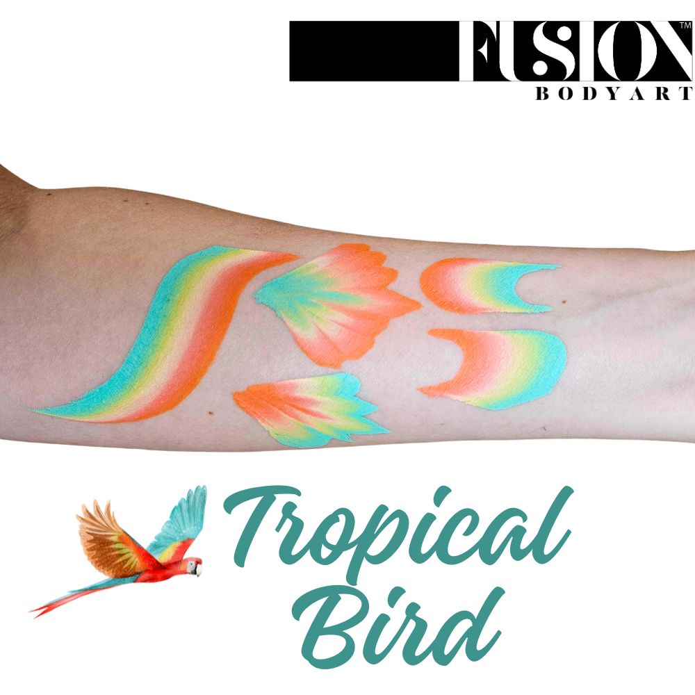 An arm shows bold orange, teal, and yellow face paint swatches like feathers. The text reads Infinityfaces Face Paint & Body Paint Aqua Fusion - Tropical Bird (One Stroke) (30g), with a parrot illustration below.