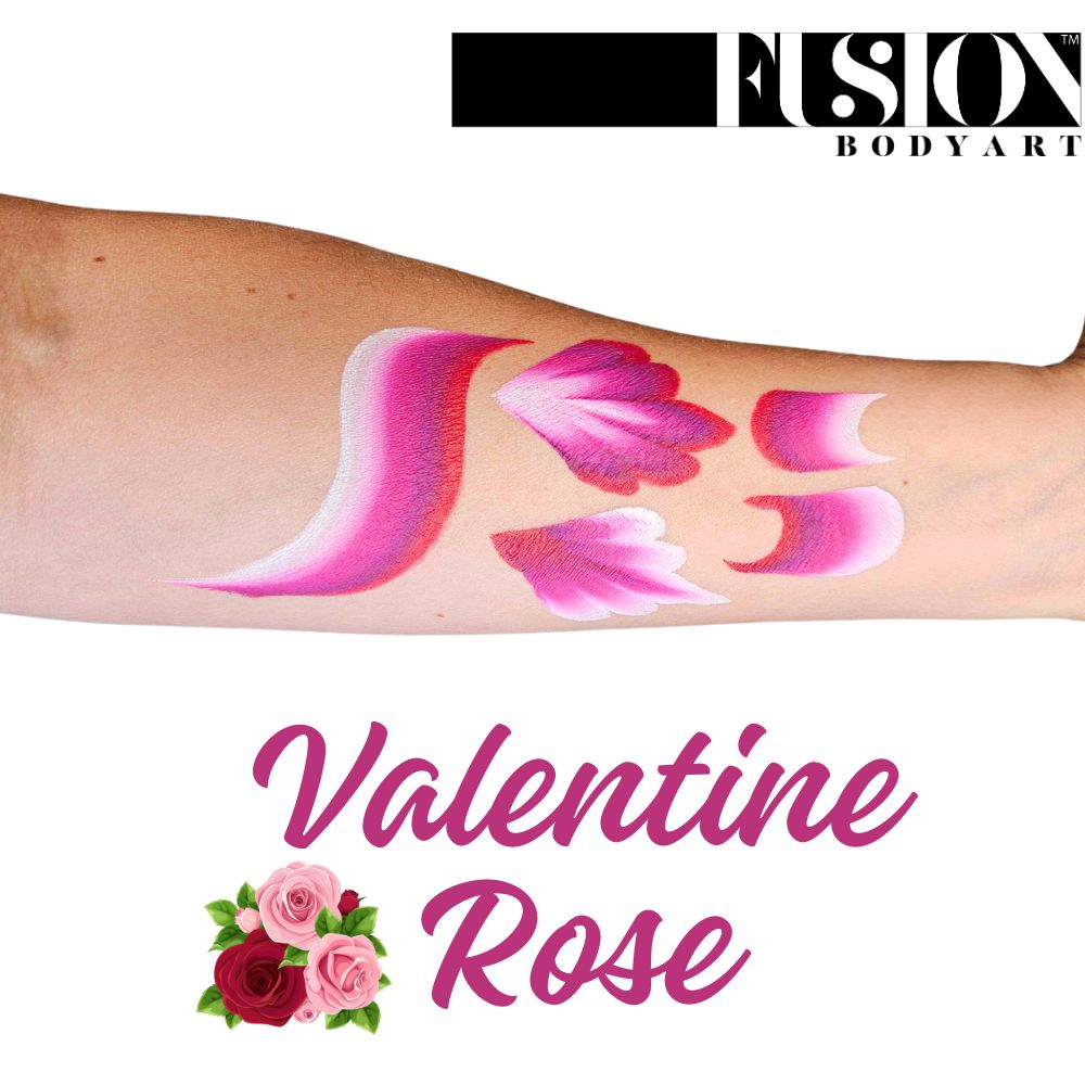 A forearm features pink and white brushstroke designs like rose petals. Above is the Infinityfaces logo; below is the text Face Paint & Body Paint Aqua Fusion - Valentine Rose (One Stroke) (30g) with rose graphics beside it.